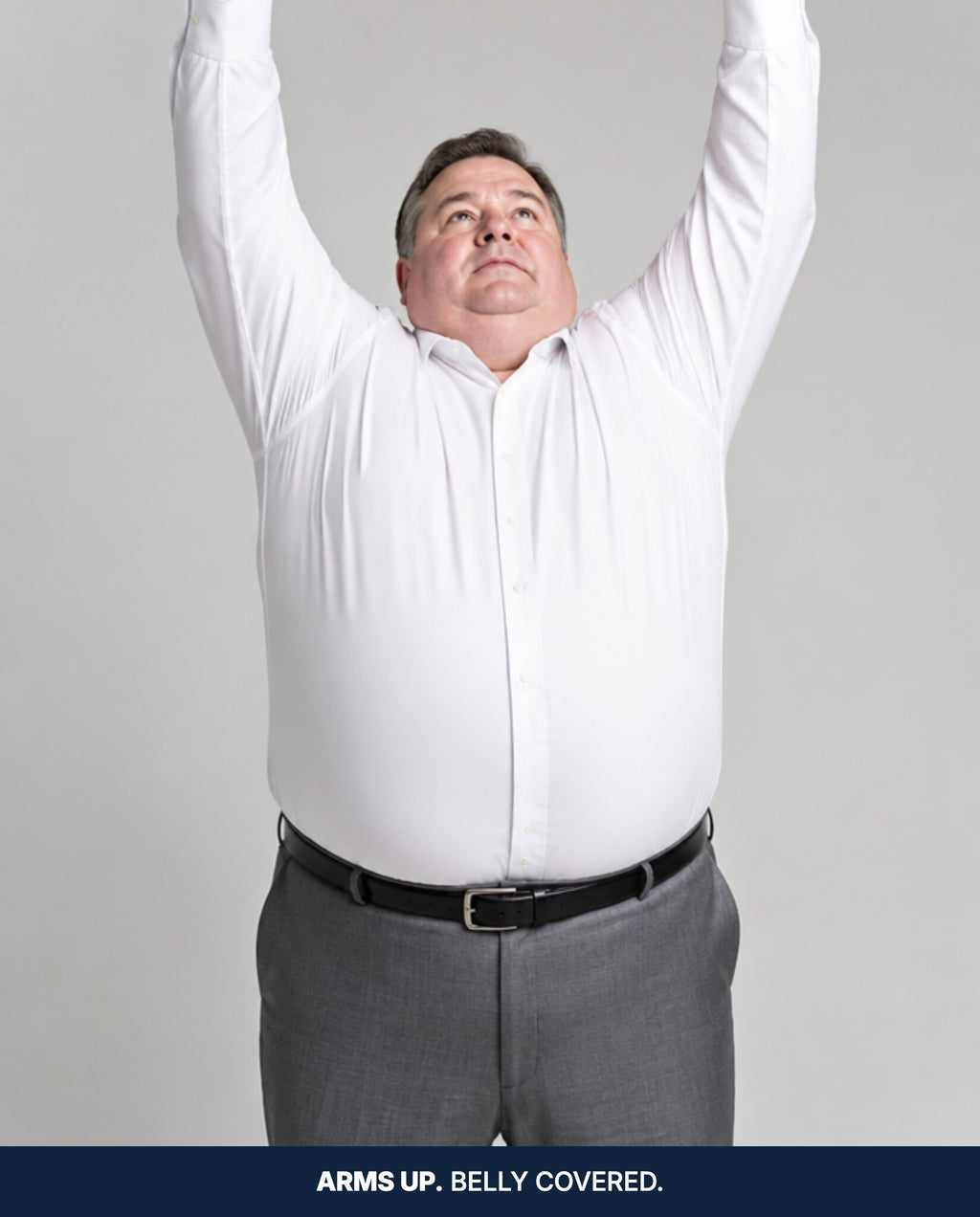 Arms raised overhead, the shirt still tucked in with no bare stomach showing